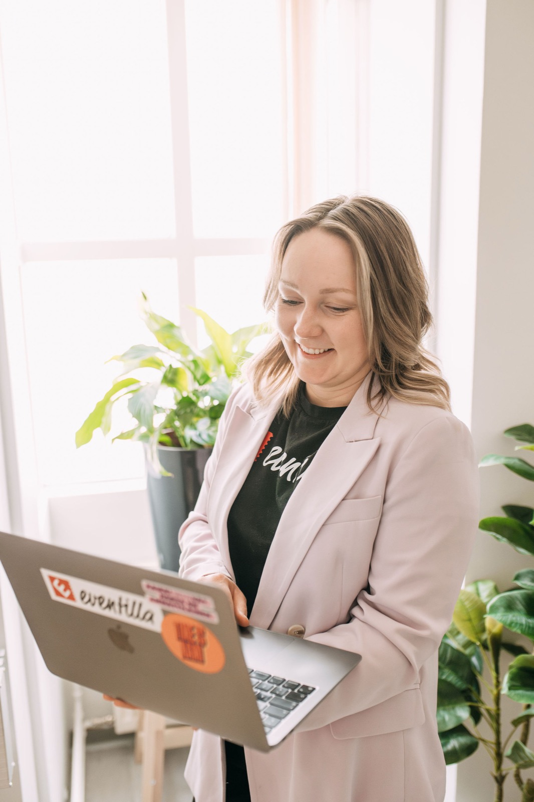A CompetenceFlow team member working on a laptop in the Oulu office in Finland